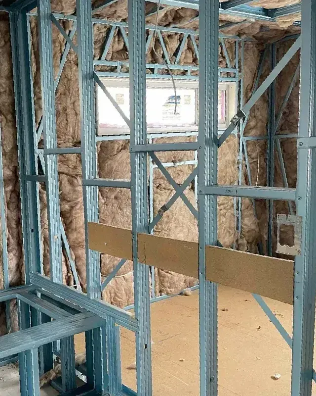 A room with a lot of metal frames and insulation on the walls — Home Insulation in Ballina NSW