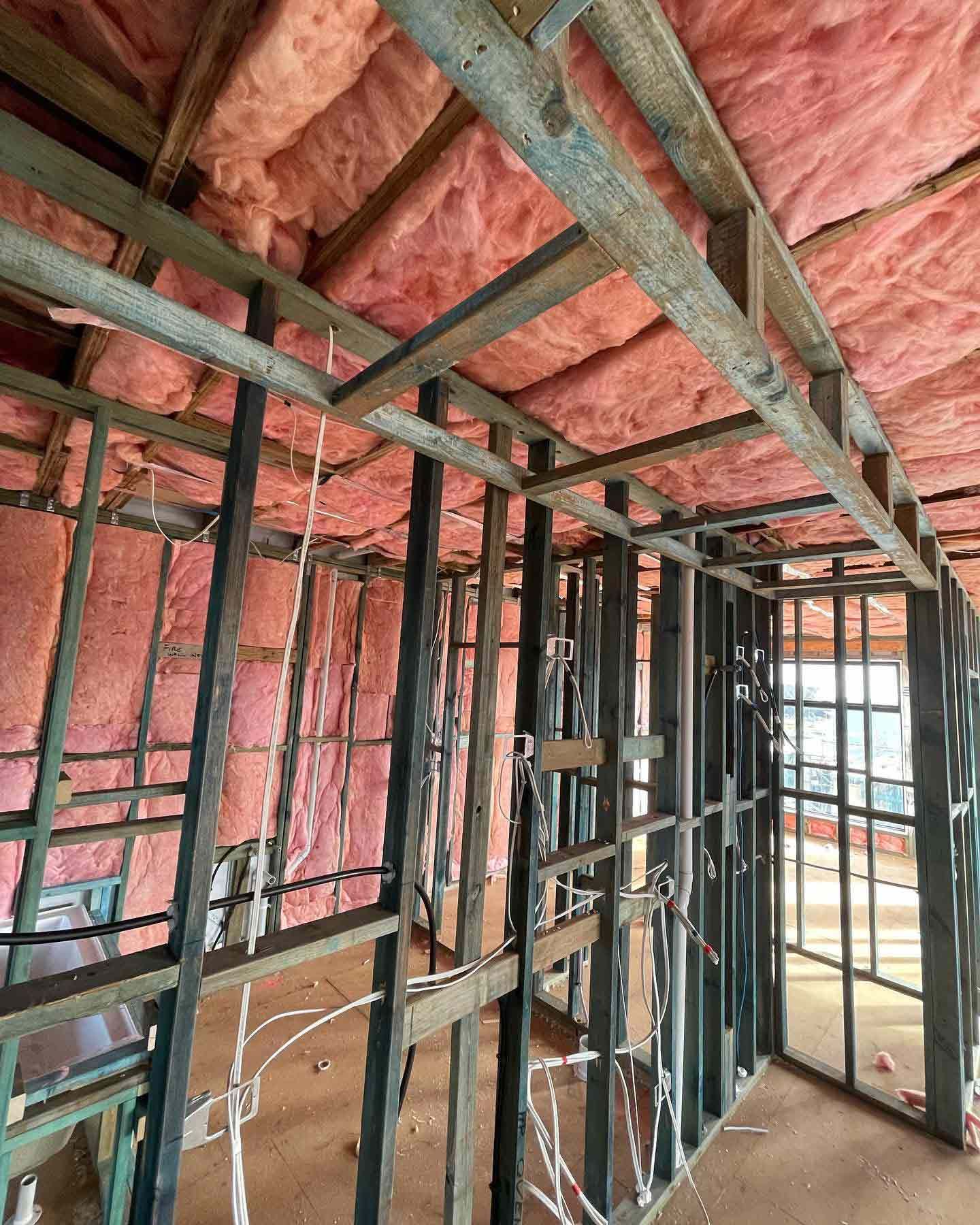 Room with a lot of insulation on the walls and ceiling with metal frame — Home Insulation in Ipswich QLD