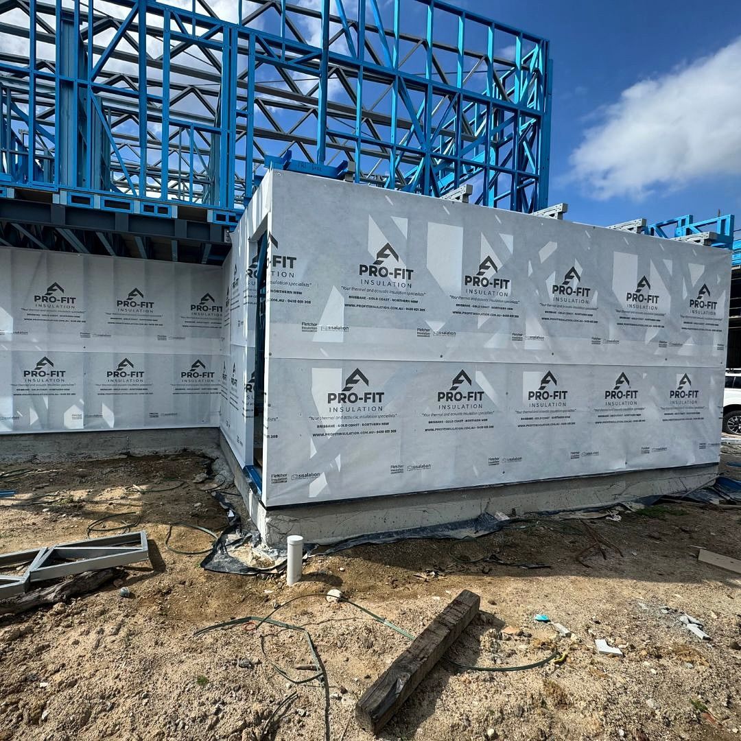 A building under construction with a lot of insulation on the walls.
