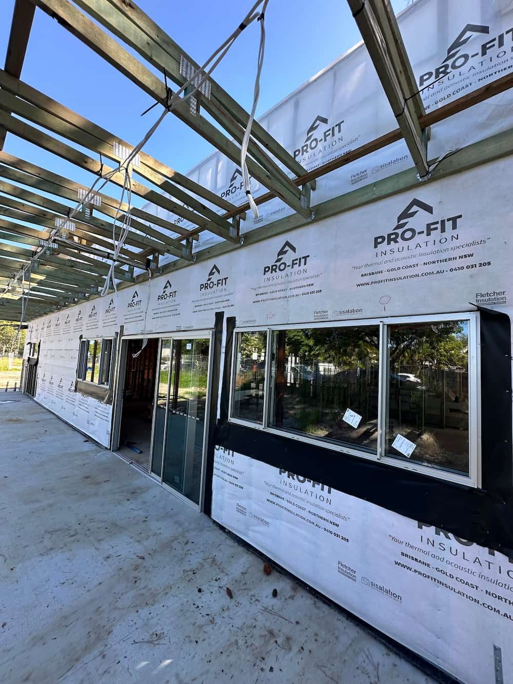 A Building Under Construction With a Lot of Windows and a Roof — Home Insulation in Brisbane QLD