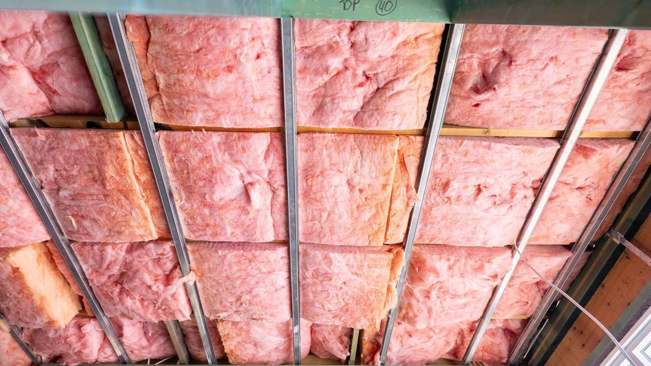 Room with a window and insulation on the walls — Home Insulation in Byron Bay NSW