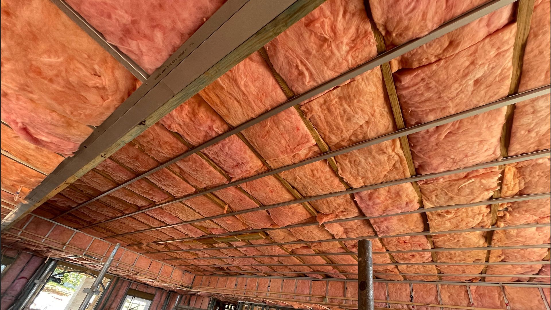Room with a lot of windows and insulation on the floor — Home Insulation in Gold Coast QLD