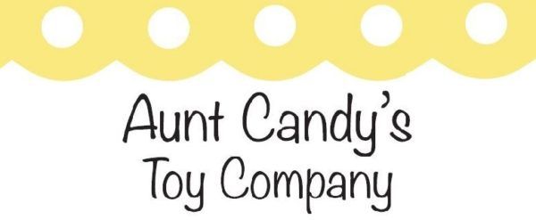 Logo for Aunt Candy's Toy Company with yellow scalloped top border with white polka dots.