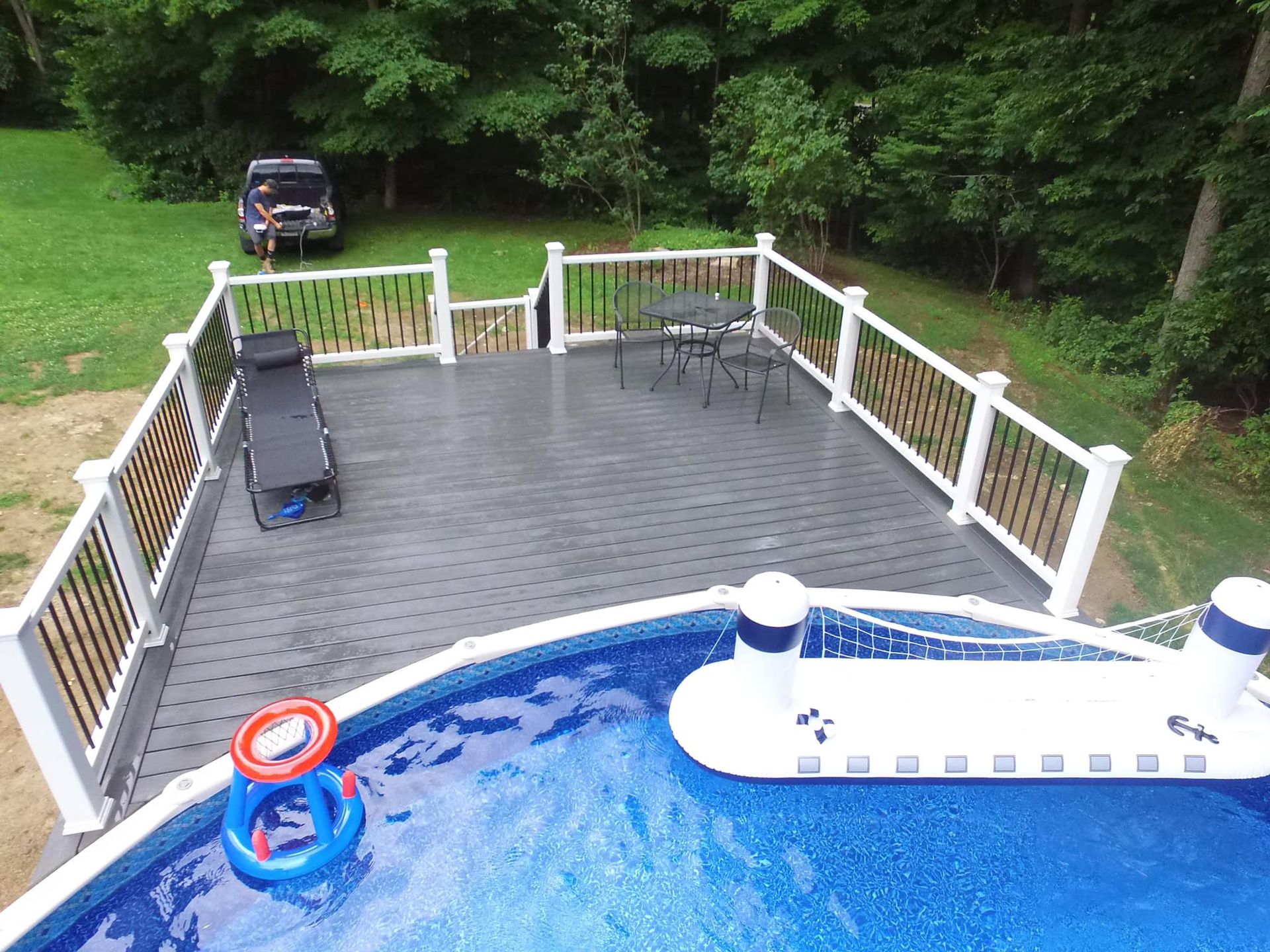 An aerial view of a deck over a swimming pool