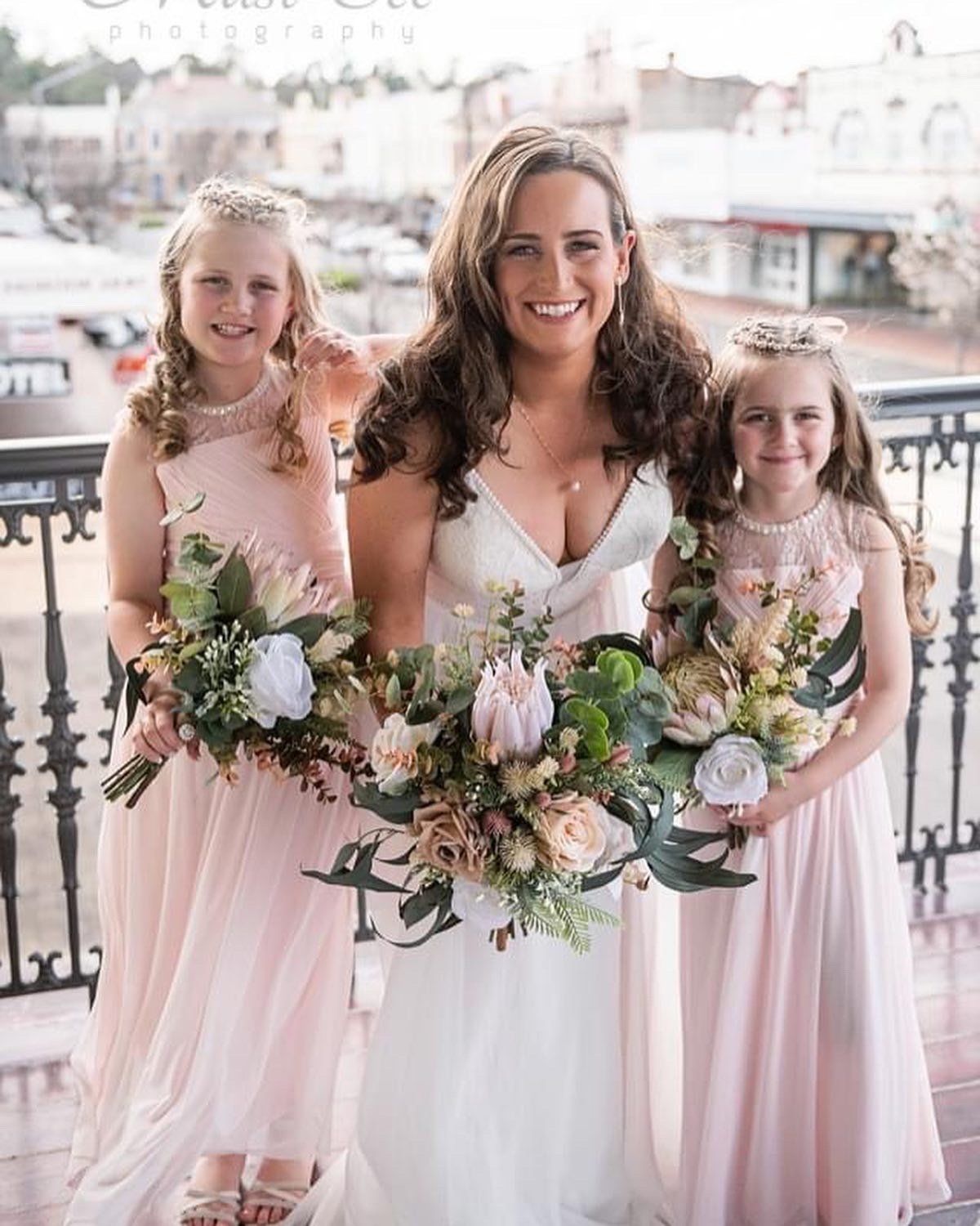 Bride at white Gown and Bridesmaid Pink Dress — Vintage La Belle In Mount Hutton NSW
