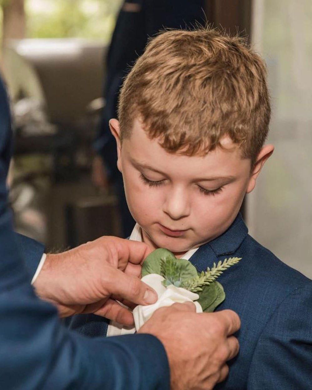 Little Boy Getting Pinned Corsage On His Suit — Vintage La Belle In Mount Hutton NSW