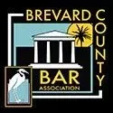 The brevard county bar association logo shows a building with columns and a bird.