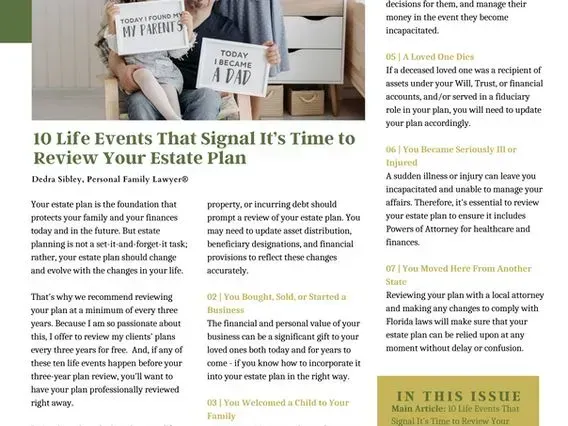 A couple is sitting in a chair holding signs.