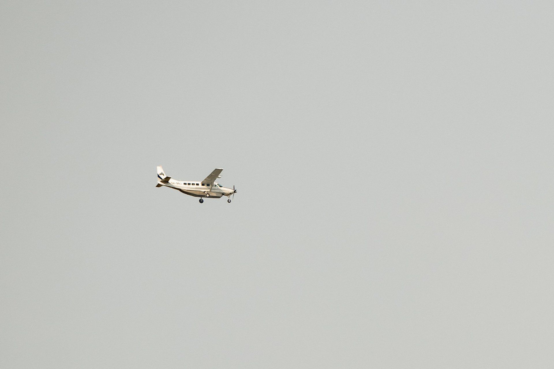 A small airplane is flying in the sky.