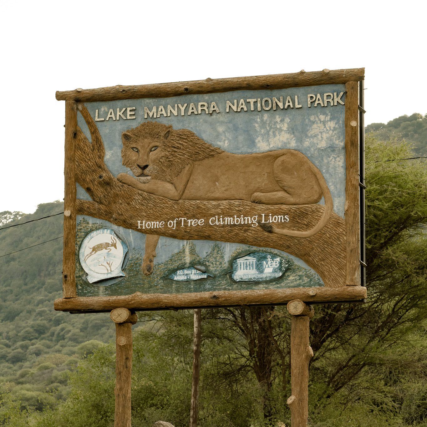 A sign for lake manyara national park with a lion on it