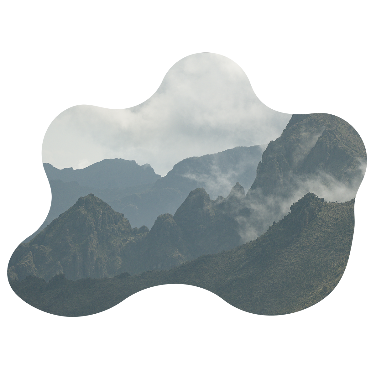 A picture of a mountain range with clouds in the sky