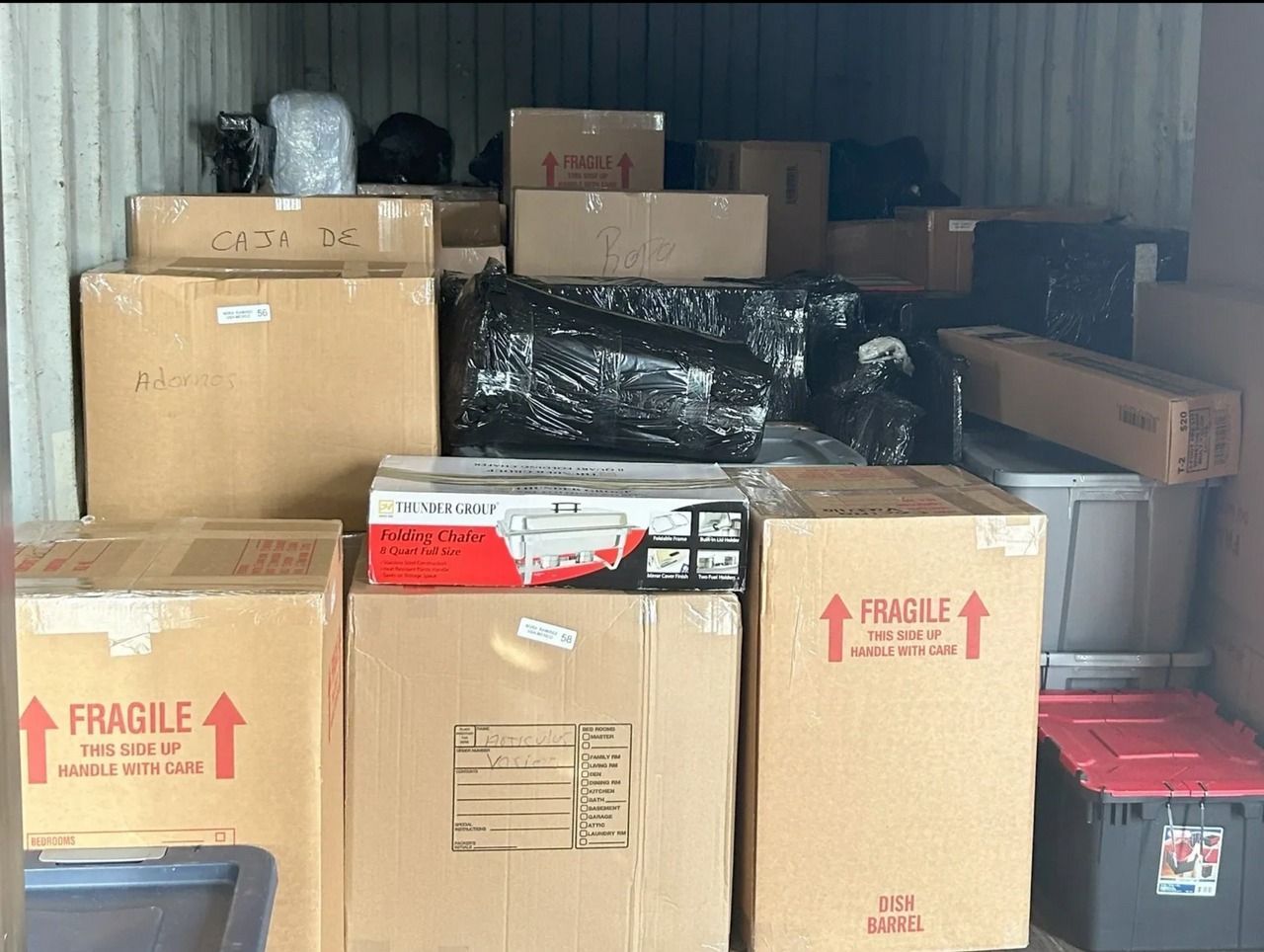 A storage container filled with boxes and fragile signs