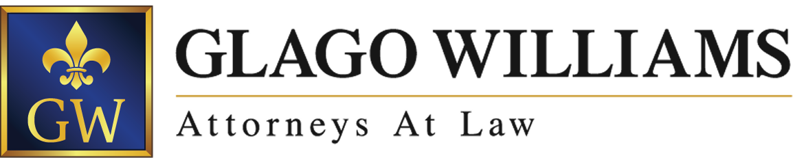 Logo of Glago Williams law firm: blue and gold emblem with 