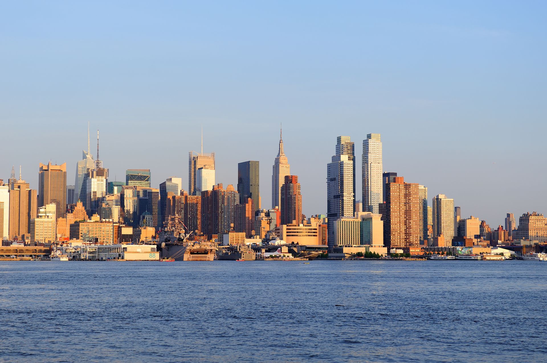 The skyline of new york city is seen from the water