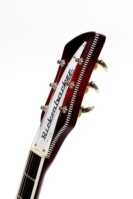 A close up of the headstock of a rickenbacker guitar