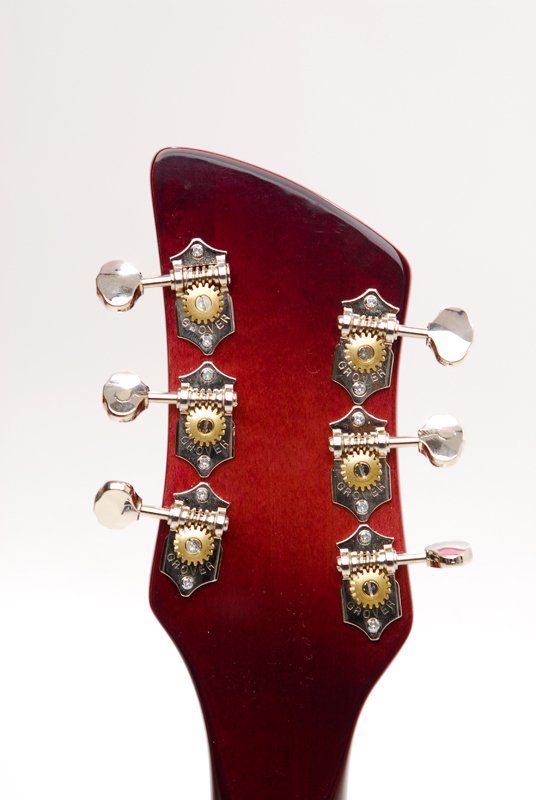 A close up of the headstock of a guitar