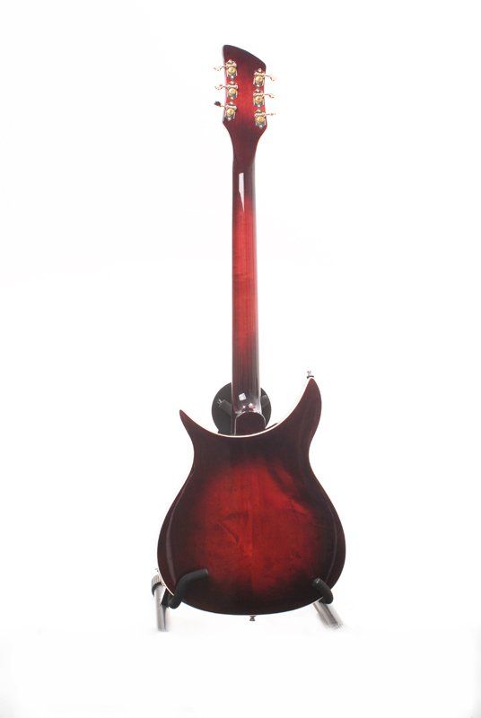 A red electric guitar is sitting on a stand on a white background.