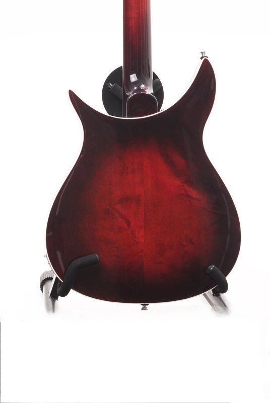 The back of a red electric guitar on a stand