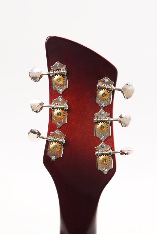 A close up of a guitar headstock on a white background