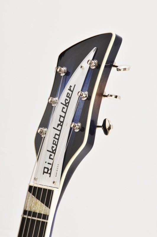 A close up of the headstock of a rickenbacker guitar