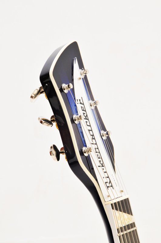 A close up of a guitar headstock on a white background.