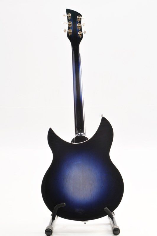 The back of a blue and black electric guitar on a stand.