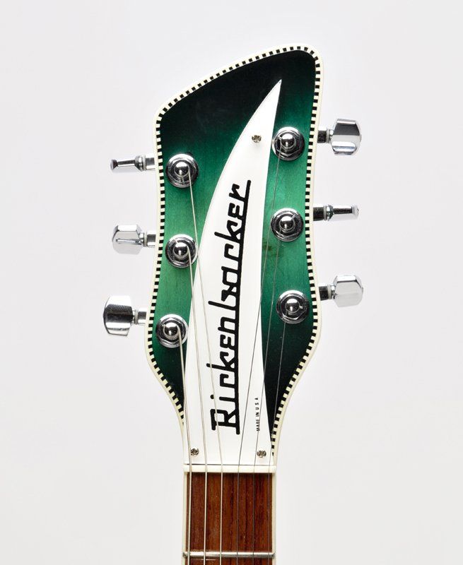 A green and white rickenbacker guitar headstock