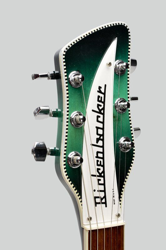 A green and white rickenbacker guitar headstock