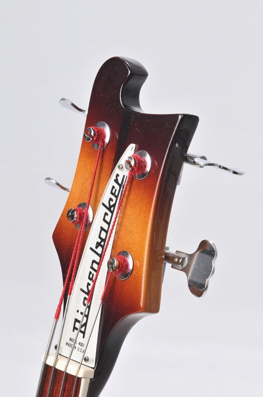 A close up of the headstock of a rickenbacker bass guitar