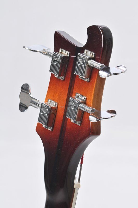 A close up of the headstock of a bass guitar
