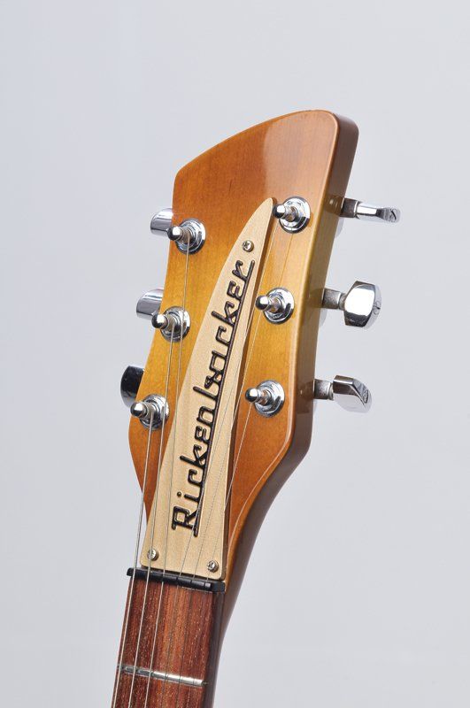A close up of the headstock of a rickenbacker guitar