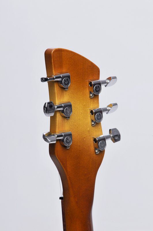 A close up of the headstock of a guitar
