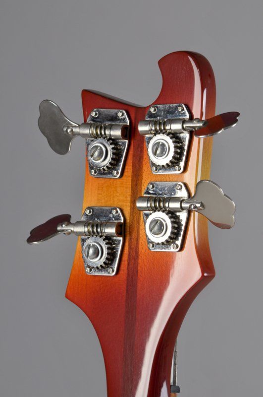 A close up of the headstock of a bass guitar