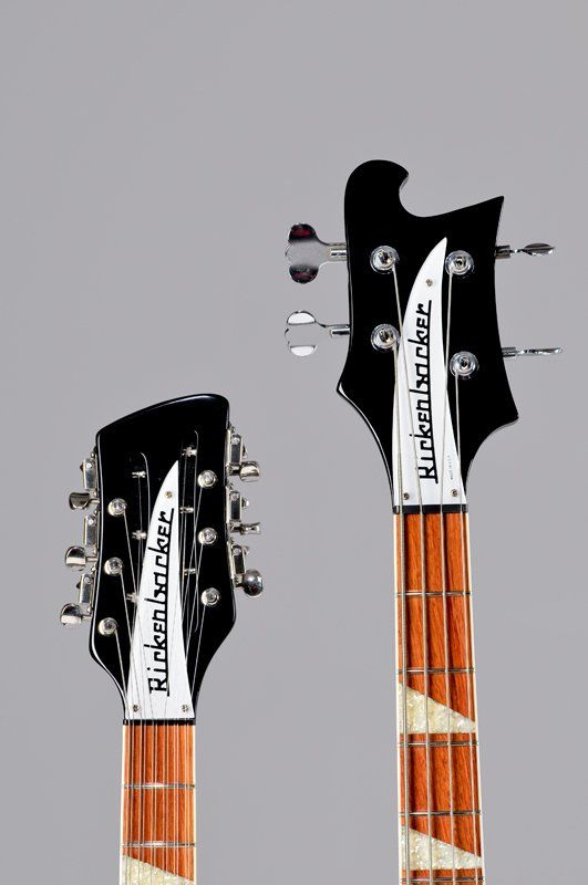 Two rickenbacker guitars are shown side by side on a gray background.