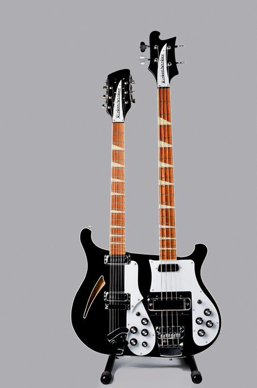 A black double neck guitar is on a stand