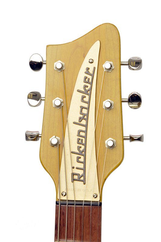 A close up of a rickenbacker guitar headstock