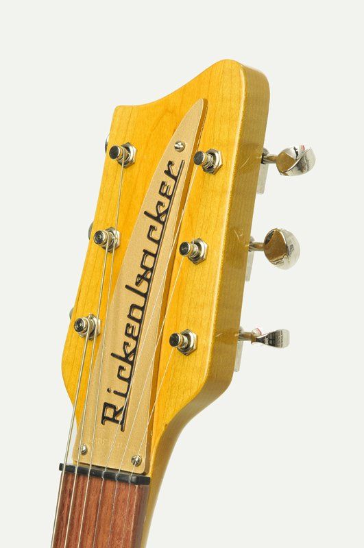 A close up of a rickenbacker guitar headstock