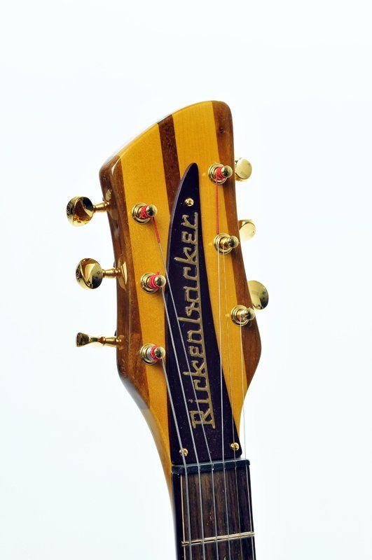 A close up of the headstock of a rickenbacker guitar