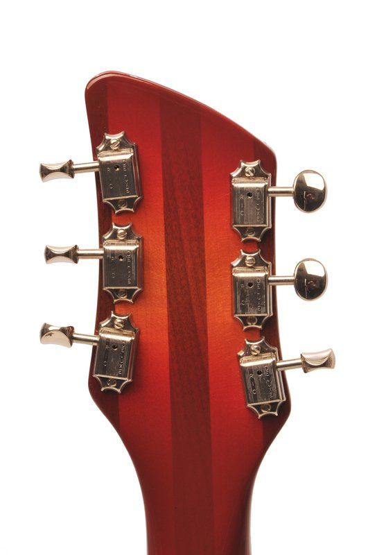 A close up of a guitar headstock on a white background