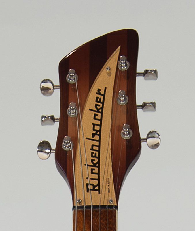 A close up of a rickenbacker guitar headstock