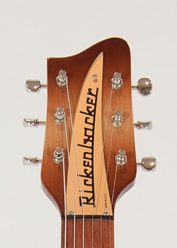 A close up of a rickenbacker guitar headstock