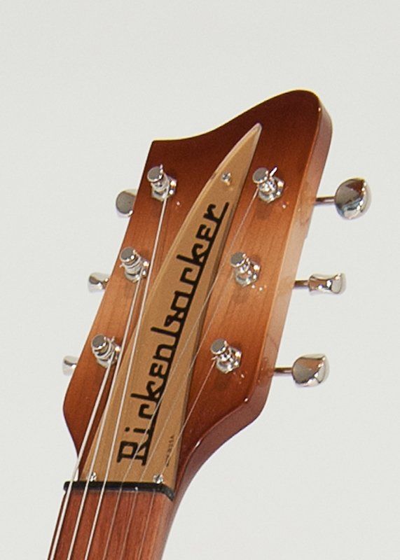 A close up of a rickenbacker guitar headstock