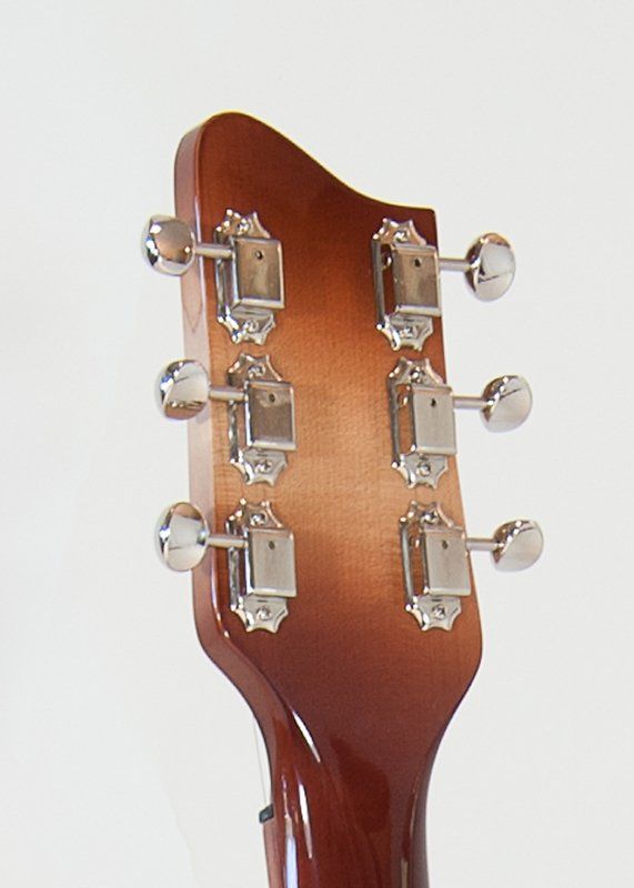 A close up of the headstock of a guitar