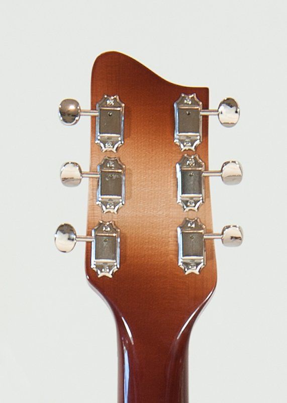 A close up of the headstock of a guitar