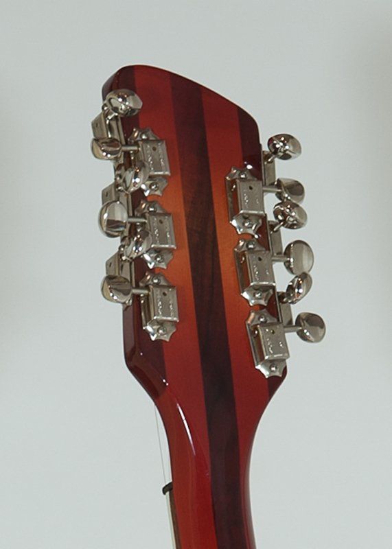 A close up of the headstock of a guitar