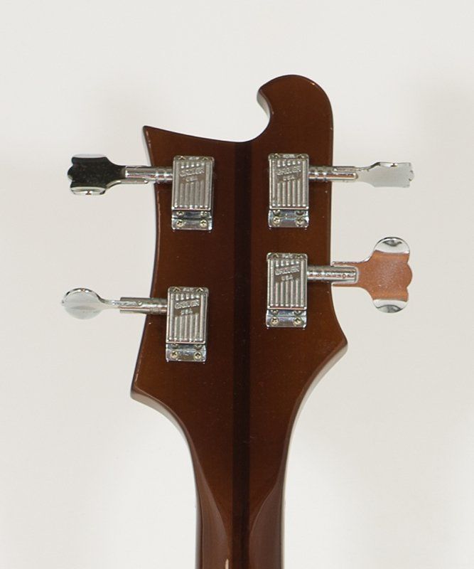 A close up of the back of a guitar headstock