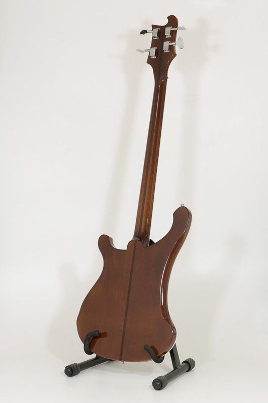 The back of a bass guitar on a stand