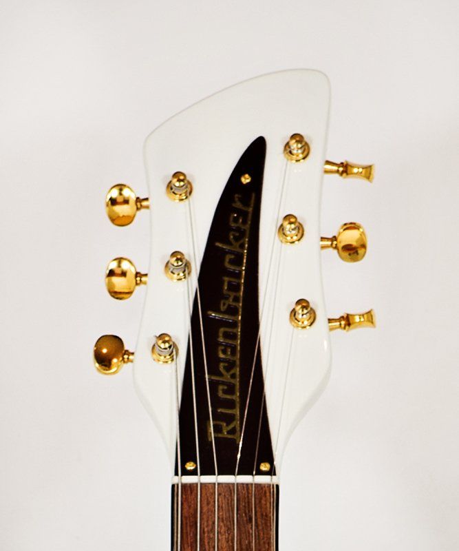 The headstock of a rickenbacker electric guitar