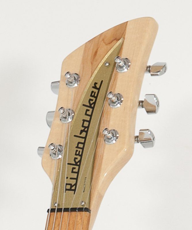 A close up of a rickenbacker guitar headstock