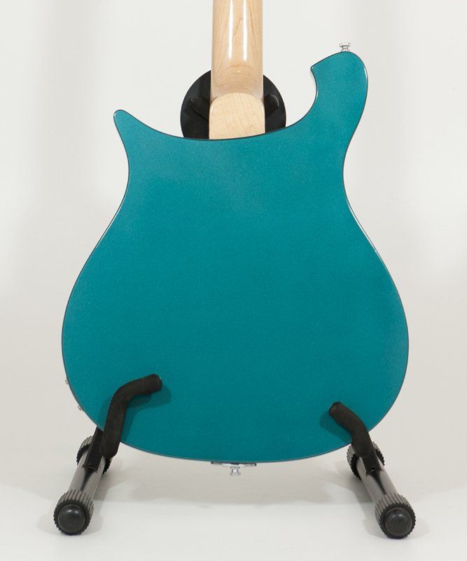 A blue guitar is sitting on a guitar stand
